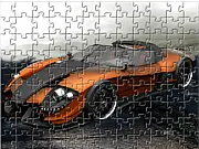 Screenshot of the free online jigsaw puzzle game G8 Sport Car Jigsaw showing scrambled pieces of a bright, high-performance sport car.