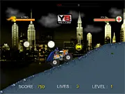 Batman Super Truck free online game screenshot showing Batman driving a large monster truck over obstacles on a Gotham City track