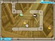 A spider swinging on a web to catch a fly while avoiding bees in the Natural Selection free online skill game