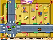 Screenshot of the free online game Toy Traffic Control showing a busy 4-way intersection with various colorful toy cars waiting for the traffic light to change.
