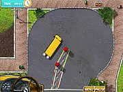 Screenshot of the free online game School Bus License 2 showing a yellow school bus performing a difficult parking maneuver on a test track with cones