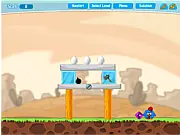 Gameplay screenshot of Chicken House 2, a physics puzzle game showing angry cartoon birds and eggs precariously balanced on wooden blocks.