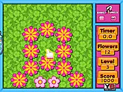 Gameplay screenshot of the Flower Click game, showing multiple cartoon flowers on a screen awaiting a quick mouse click.
