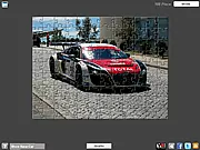 Screenshot of the Race Car Jigsaw Puzzle game in progress, showing fragmented pieces and the partial image of a red and white Audi race car.