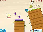 Gameplay screenshot of the free online game Monster Must Die Level Pack, showing unique-shaped characters lined up on a structure, preparing to be launched to destroy a large yellow monster.