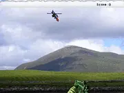 Heli Shooter 3D online game screenshot showing a first-person view of a soldier aiming at an enemy helicopter over a battlefield