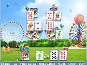 Screenshot of Happy Park Solitaire game showing a colorful layout of stacked playing cards on a nature background