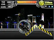 Techno Rider free online game screenshot showing a futuristic bike performing a stunt jump over obstacles