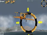 Stunt Pilot 2 San Francisco free online racing game screenshot showing a plane flying through a ring near the Golden Gate Bridge
