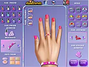 Princess Aurora Nails Makeover game screenshot showing close-up view of Princess Aurora's hand with beautifully decorated nails and rings.