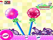 Sweet Lollipops Decor game screenshot showing multiple decorated lollipops with colorful sprinkles and icing on PlayArcadeHub