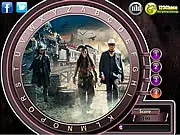 Gameplay screenshot of The Lone Ranger Hidden Alphabets showing a Wild West image with various letters of the alphabet faintly visible in the background.