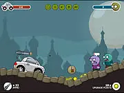 Play Wheels and Zombies free online game screenshot; upgraded car driving through a horde of zombies on a desolate highway