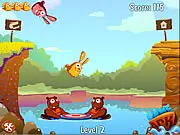Beaverz game screen showing two beavers operating a trampoline to bounce a bunny towards the opposite shore, with a crow flying overhead for a bonus hit