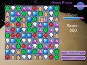 GemsPlanet free match 3 puzzle online game featuring glittering, colorful jewels and a space background.