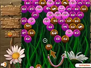Woobies Winter free online bubble shooter game, featuring a cannon aiming at trapped, colorful, furry Woobies against a snowy background.