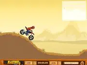 A motorcycle performing a difficult, high-flying jump over a canyon on a rugged mountain track in the Deadly Stunts online game.