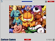 Garfield Jigsaw puzzle game showing scattered pieces of a cartoon image featuring Garfield the cat and Odie the dog