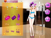 A fashionable blonde girl posing in a beautiful purple evening gown and accessories in the Fashion Purple Dress online game.