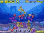 Chains of colorful, interconnected blobs floating in a puzzle game environment, ready to be clicked in the StickyLinky online game.