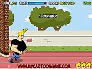 The in-game screen for Johnny Bravo New Challenge, showing the muscular blonde character running at high speed towards a brick wall obstacle he must avoid.