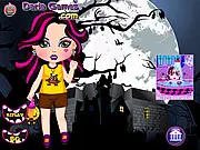 The in-game screen for Monster Baby Dressup, showing an adorable, colorful baby monster girl with multiple customization options for clothes, hair, and accessories around her.