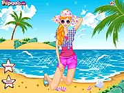 The in-game screen for Beach Fashion Pure Beauty, showing a young girl standing on a sandy beach next to the ocean, ready to be dressed up with various summer outfits and accessories.