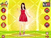 Gameplay screenshot of the Lena Meyer-Landrut Dress Up game, showing the German singer on a concert stage with various outfit options, shoes, and accessories to choose from