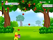 Winnie the Pooh standing with a basket trying to catch red and green apples falling from the sky in an arcade game scene