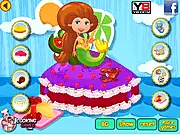Screenshot of Magical Mermaid Cake game showing a three-tiered cake decorated with blue and purple frosting, fondant seashells, and a mermaid tail