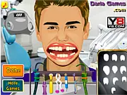 Playing Justin Bieber Teeth Doctor, a celebrity simulation game using a drill tool to fix a pop star's imperfect teeth free online