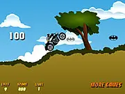 Batman Bike free online game screenshot, the Dark Knight riding the Batcycle over a steep ramp in a Gotham City scene