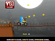 Doraemon driving his ATV across a bumpy, moonlit Halloween track while collecting a cake