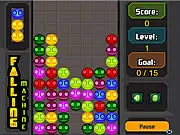 Screenshot of Falling Machine game showing a screen full of rapidly dropping colorful faces that need to be matched and cleared, free online puzzle game