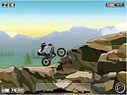 Free online gameplay screenshot of Moto Trial Fest 4 showing a trial bike rider navigating a treacherous, physics-based obstacle course at speed