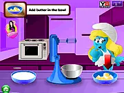 Smurfette Birthday Cake game screenshot showing a colorful, decorated cake with Smurfette and other Smurf figurines