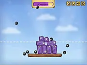 Qubilz physics puzzle game screenshot showing a tall, wobbly structure built from jello blocks being hit by black destructive balls