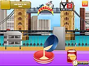 Gameplay screenshot of the London Gingerbread Cookies game, showing various gingerbread men shapes ready for baking and decorating with festive Christmas icing.