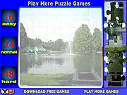 Puzzle Lake Jigsaw Online game screenshot showing a partially completed puzzle of a scenic lake, play free puzzle game on PlayArcadeHub