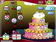 Screenshot of Christmas Cake Decorator online game showing a round holiday cake fully decorated with festive sprinkles, a gingerbread man, and snow-themed frosting
