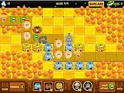 Gameplay screenshot of Sweet Planet showing a variety of defensive towers and sugar production drills defending the central core of a colorful, sugary-looking planet against invading alien units.