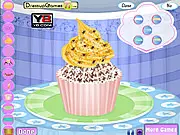Cupcake Decor free online game showing a decorated cupcake with a festive holiday theme, colorful frosting, and sprinkles