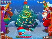 Christmas Express free online arcade game featuring a one-eyed alien bouncing presents to Santa