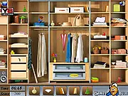 Screenshot of the Wardrobe Room Objects game showing a cluttered closet interior with many hidden objects waiting to be found.