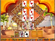 Aladdin Solitaire free online card game screenshot showing an ornate Middle Eastern-themed card layout with scattered gold coins.