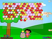 Dora Bubbleshooter game screenshot showing Dora aiming a cannon at a cluster of colorful falling bubbles