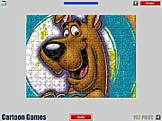 Scooby-Doo Jigsaw Puzzle free online game screenshot, showing Scooby-Doo and Shaggy with puzzle pieces scattered on the board.
