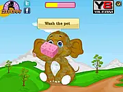 Screenshot of Baby Elephant Day Care free online game showing a cute baby elephant being cleaned or dressed with accessories