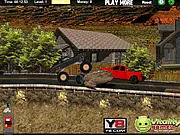 Heavy Wheels Monster Truck free online game screenshot showing a large truck using a nitro boost to jump over a huge gap in the level