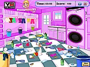 Laundry Cleanout free online game screenshot showing a washing machine, clothes hamper, and neat piles of folded laundry